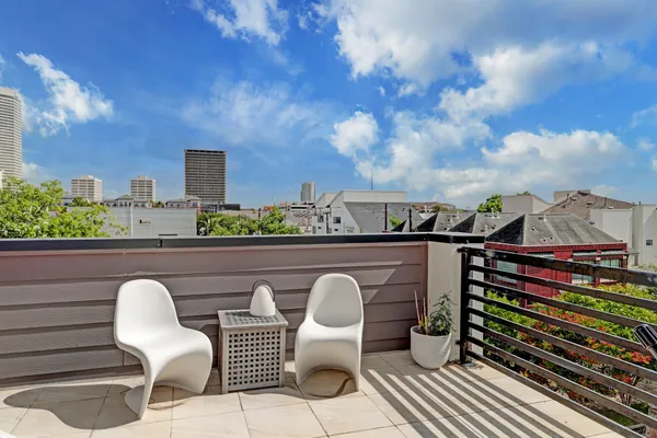 a view of a chairs and table in patio