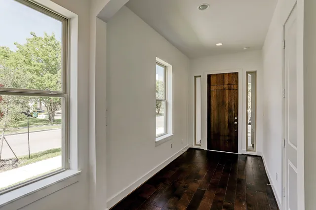 a view of entryway with wooden floor and stairs