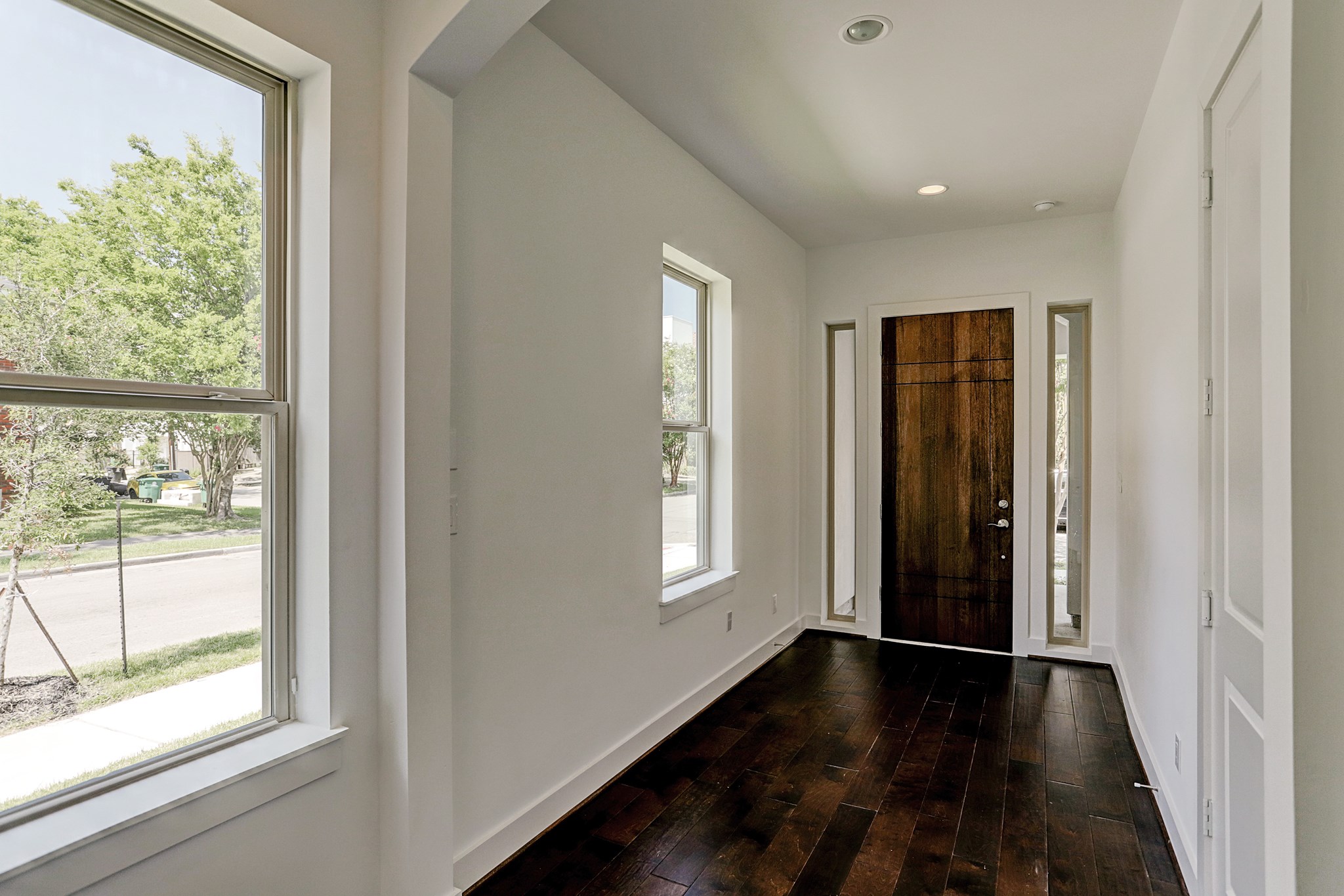 1402 Eberhard Street Houston, TX 77019 - Photo 8 of 50 a view of empty room with wooden floor and fan