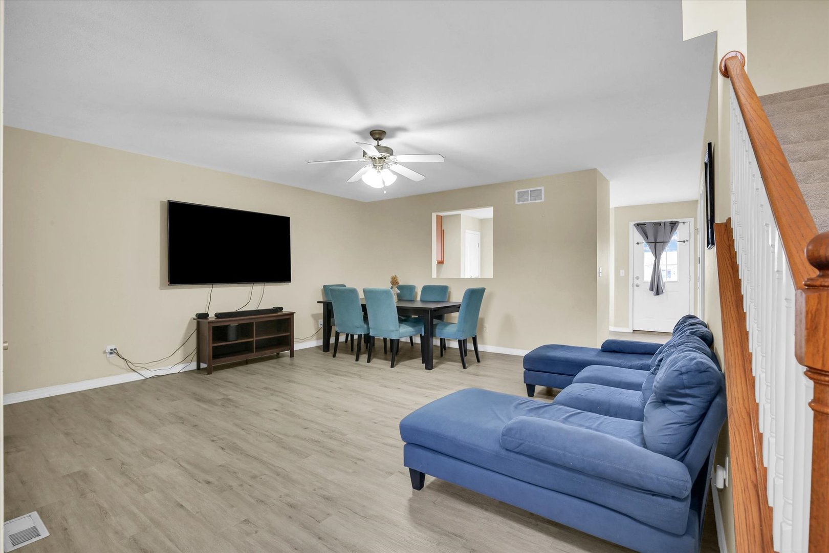 3715 Boulder Ridge Drive Champaign, IL 61822 - Photo 6 of 29 a living room with furniture and a flat screen tv