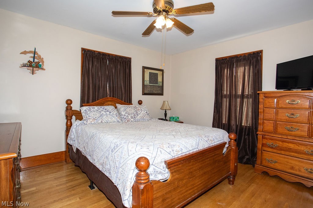 213 Como Street Struthers, OH 44471 - Photo 10 of 25 Master bedroom with wood floors and ceiling fan