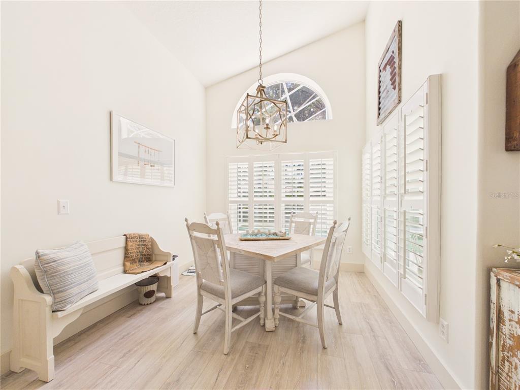 426 Long Cove Road Ormond Beach, FL 32174 - Photo 18 of 73 a workspace with wooden floor and a window