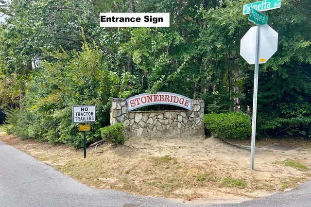 a view of a house with a backyard and a tree