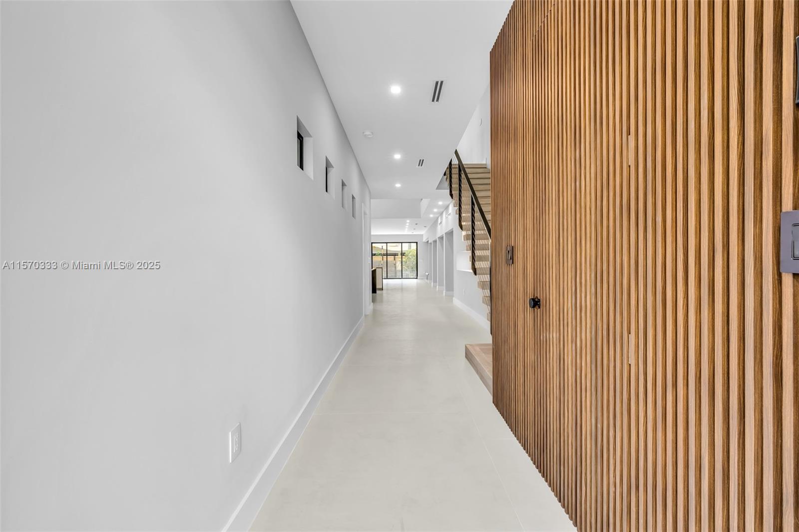 808 Southwest 9th Street, Unit 808A Fort Lauderdale, FL 33315 - Photo 11 of 30 a view of a hallway with wooden floor and staircase