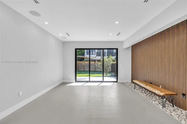 a view of an house with backyard porch and sitting area