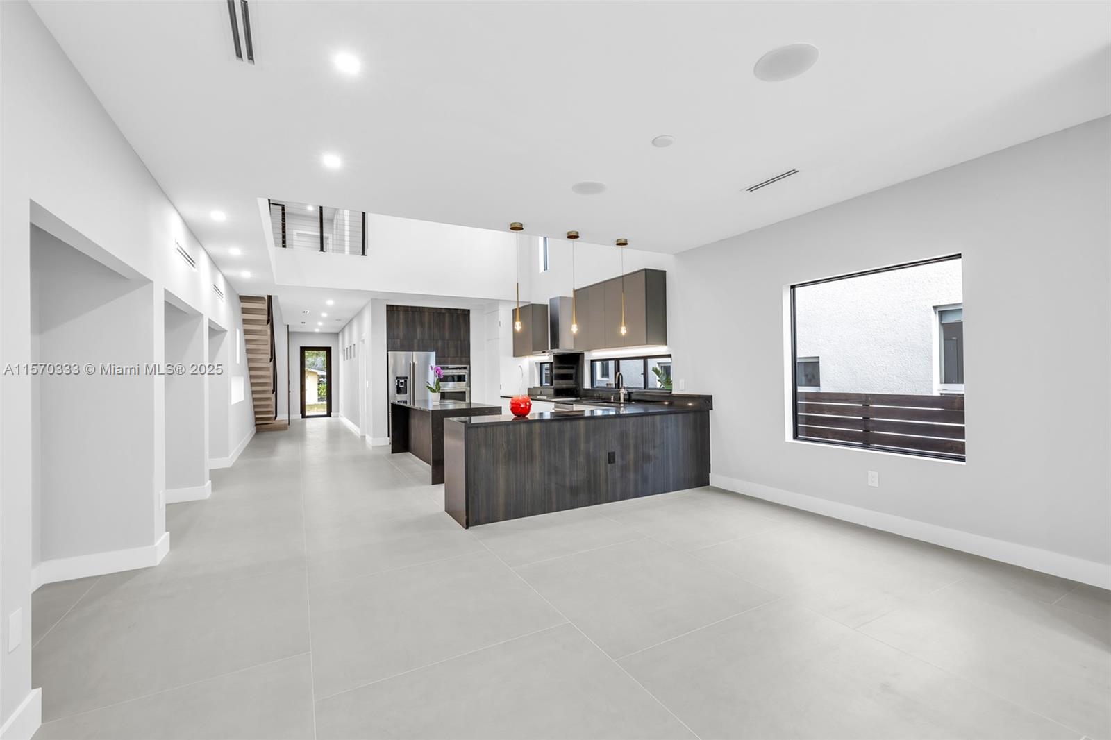 808 Southwest 9th Street, Unit 808A Fort Lauderdale, FL 33315 - Photo 17 of 30 a living room with furniture and a kitchen