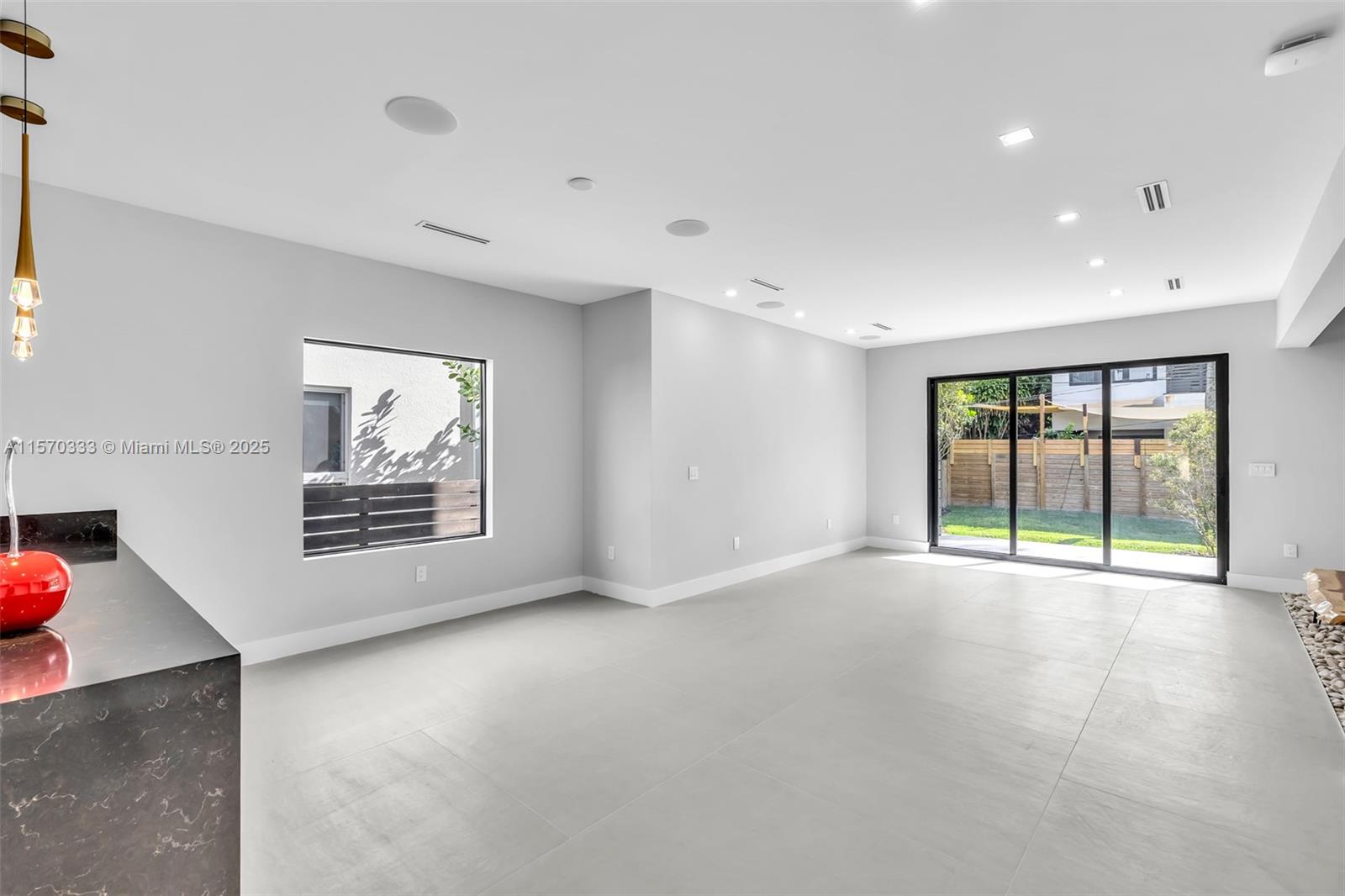 808 Southwest 9th Street, Unit 808A Fort Lauderdale, FL 33315 - Photo 7 of 30 an empty room with windows