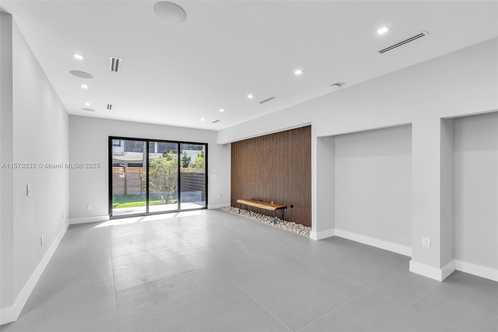 808 Southwest 9th Street, Unit 808A Fort Lauderdale, FL 33315 - Photo 8 of 30 a view of an empty room with a sliding door