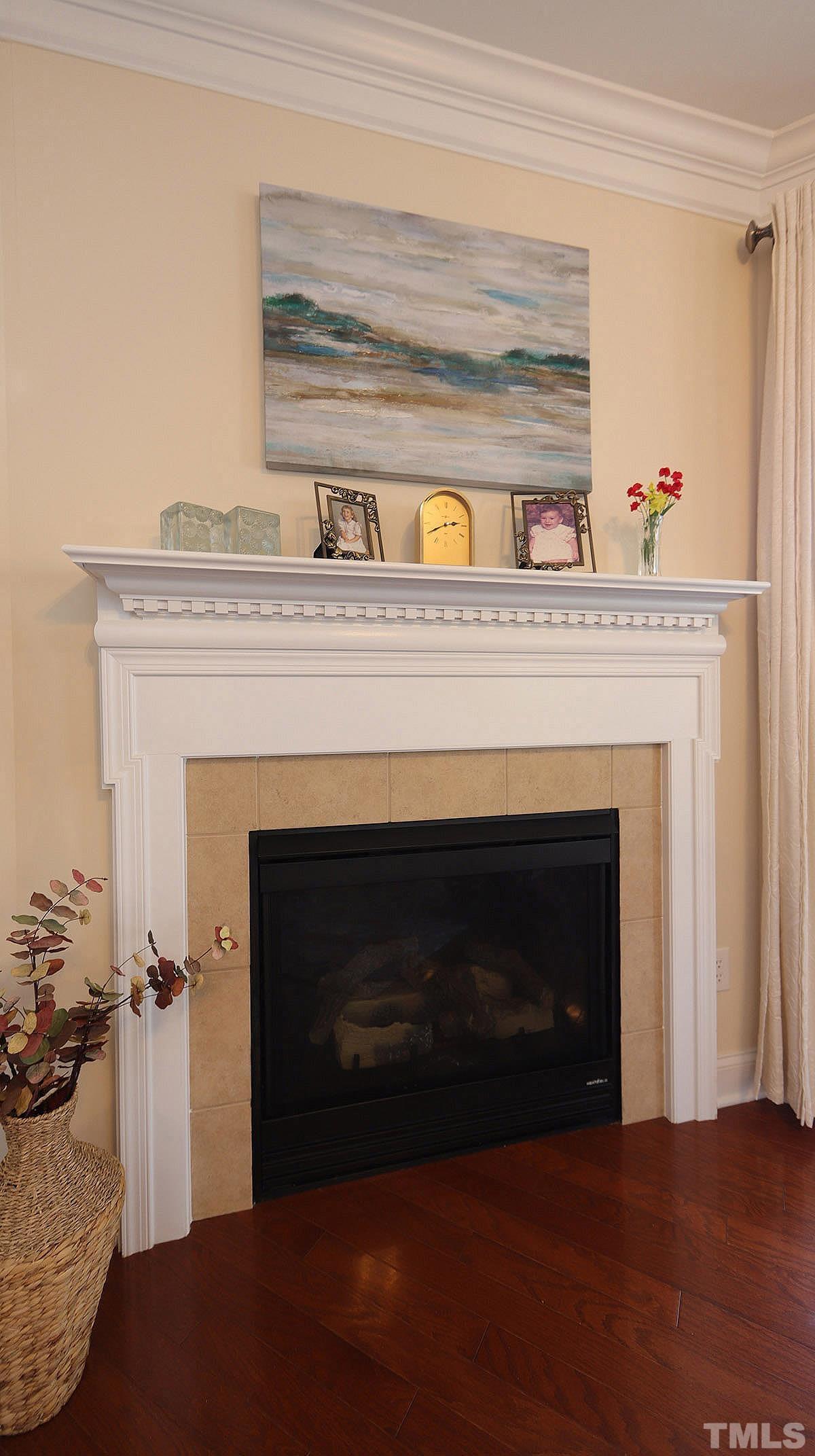 10411 Rosegate Court, Unit 202 Raleigh, NC 27617 - Photo 11 of 35 a living room with a fireplace and a fireplace