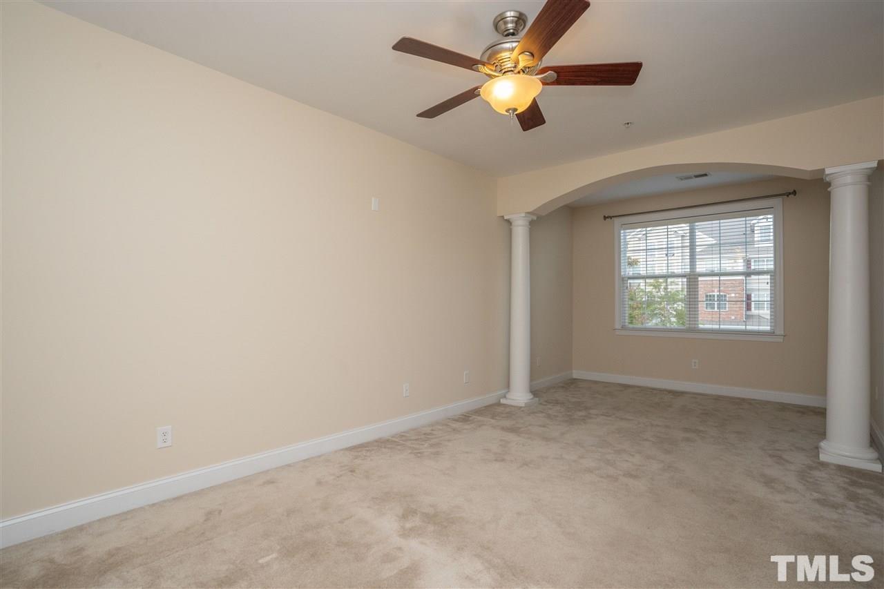 10411 Rosegate Court, Unit 202 Raleigh, NC 27617 - Photo 20 of 35 an empty room with a window and a fan