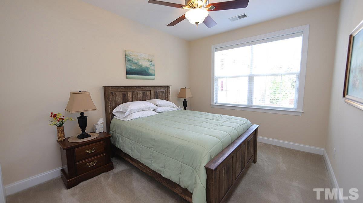 10411 Rosegate Court, Unit 202 Raleigh, NC 27617 - Photo 25 of 35 a bedroom with a bed and a window