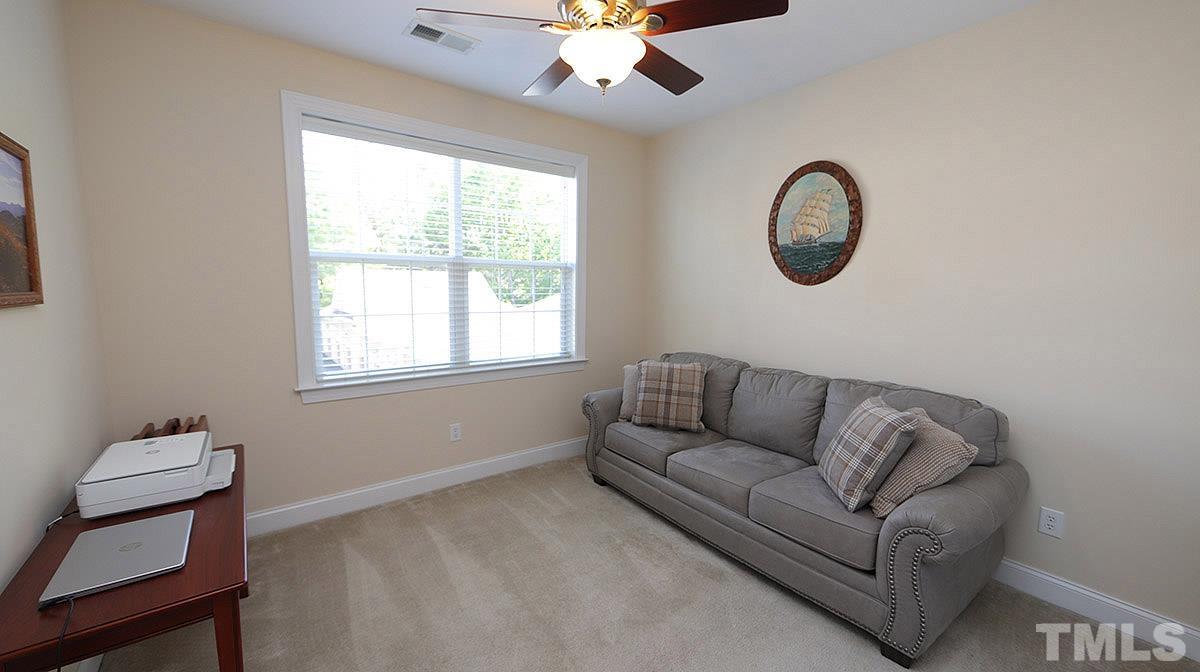 10411 Rosegate Court, Unit 202 Raleigh, NC 27617 - Photo 26 of 35 a living room with furniture and a window