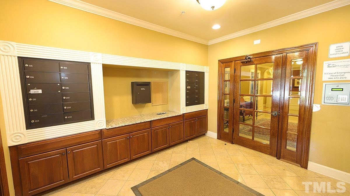 10411 Rosegate Court, Unit 202 Raleigh, NC 27617 - Photo 3 of 35 a spacious bathroom with a shower sink and mirror