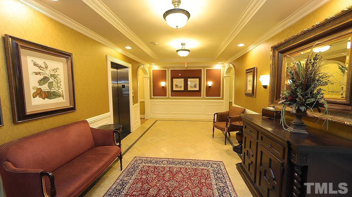 10411 Rosegate Court, Unit 202 Raleigh, NC 27617 - Photo 4 of 35 a living room with furniture and a rug