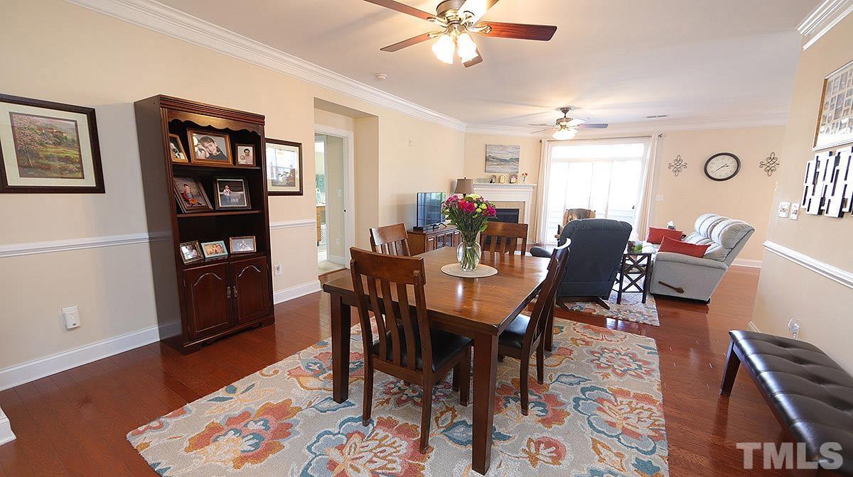 10411 Rosegate Court, Unit 202 Raleigh, NC 27617 - Photo 6 of 35 a view of a dining room with furniture and wooden floor