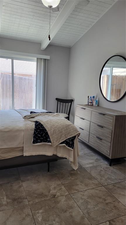 500 North Jefferson Avenue, Unit E5 Sarasota, FL 34237 - Photo 14 of 22 a bedroom with a bed and a mirror