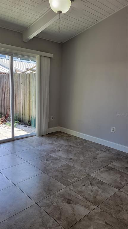 500 North Jefferson Avenue, Unit E5 Sarasota, FL 34237 - Photo 17 of 22 a view of an empty room with glass door
