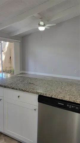 a view of a kitchen counter space and cabinets