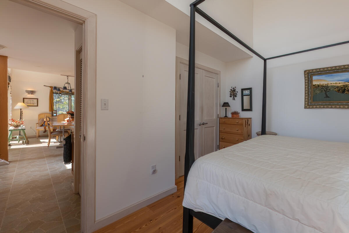 91 Meadow Point Road Lamoine, ME 04605 - Photo 24 of 42 Bedroom 1st floor glimpse to Dining area