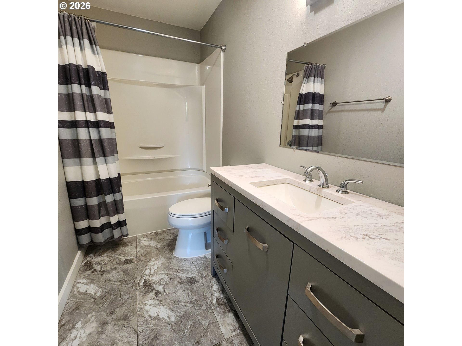 54047 West Lane Road Scappoose, OR 97056 - Photo 9 of 44 a bathroom with a granite countertop sink toilet a shower and a mirror