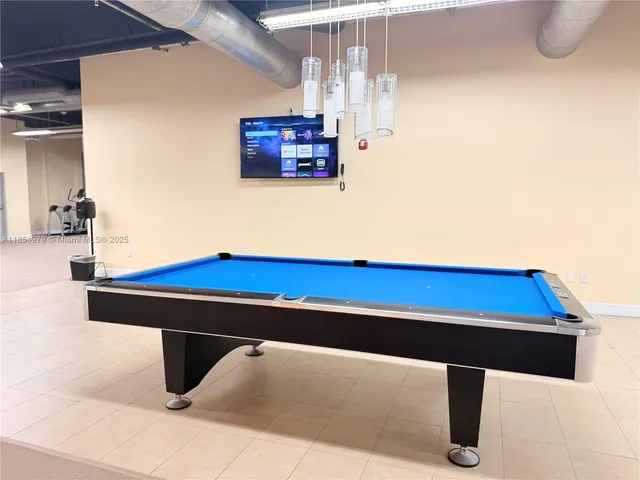 a view of table and chair in the room
