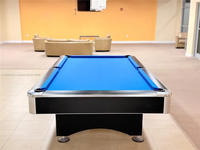 a living room with couches and a flat screen tv