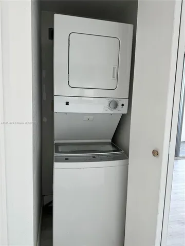 a kitchen with granite countertop cabinets stove and microwave