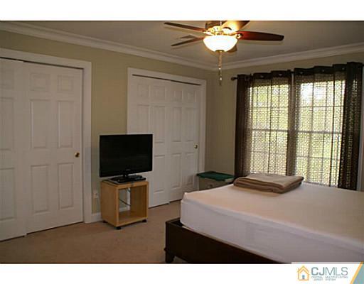 16 Westley Road Old Bridge, NJ 08857 - Photo 13 of 25 a bedroom with a bed and a flat screen tv