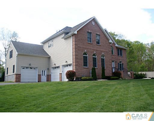 16 Westley Road Old Bridge, NJ 08857 - Photo 18 of 25 a front view of a house with a yard and garage