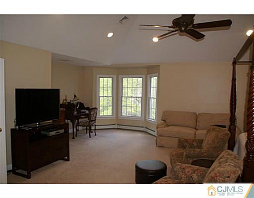 16 Westley Road Old Bridge, NJ 08857 - Photo 10 of 25 a living room with furniture and a flat screen tv