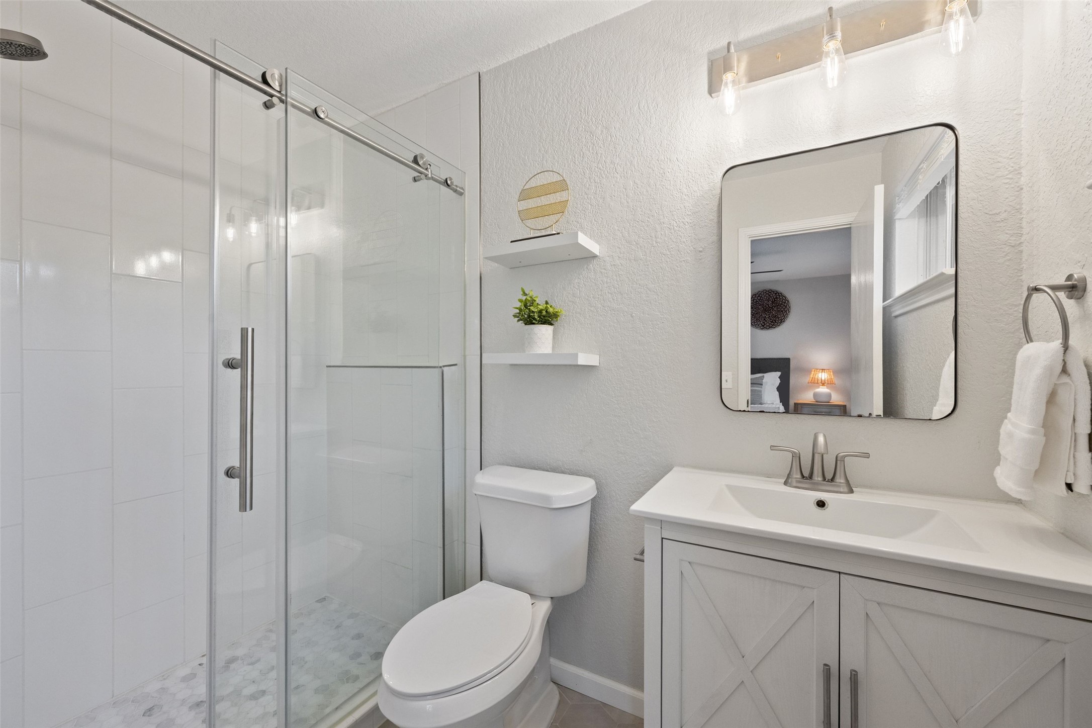 4529 Best Way Austin, TX 78725 - Photo 12 of 34 Fully updated bathroom attached to main bedroom with walk-in shower