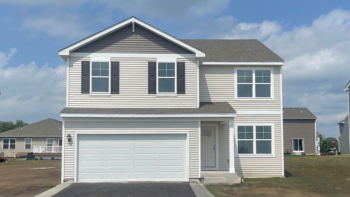 423 Fry Street Hebron, IN 46341 - Photo 1 of 32 a front view of a house with garage