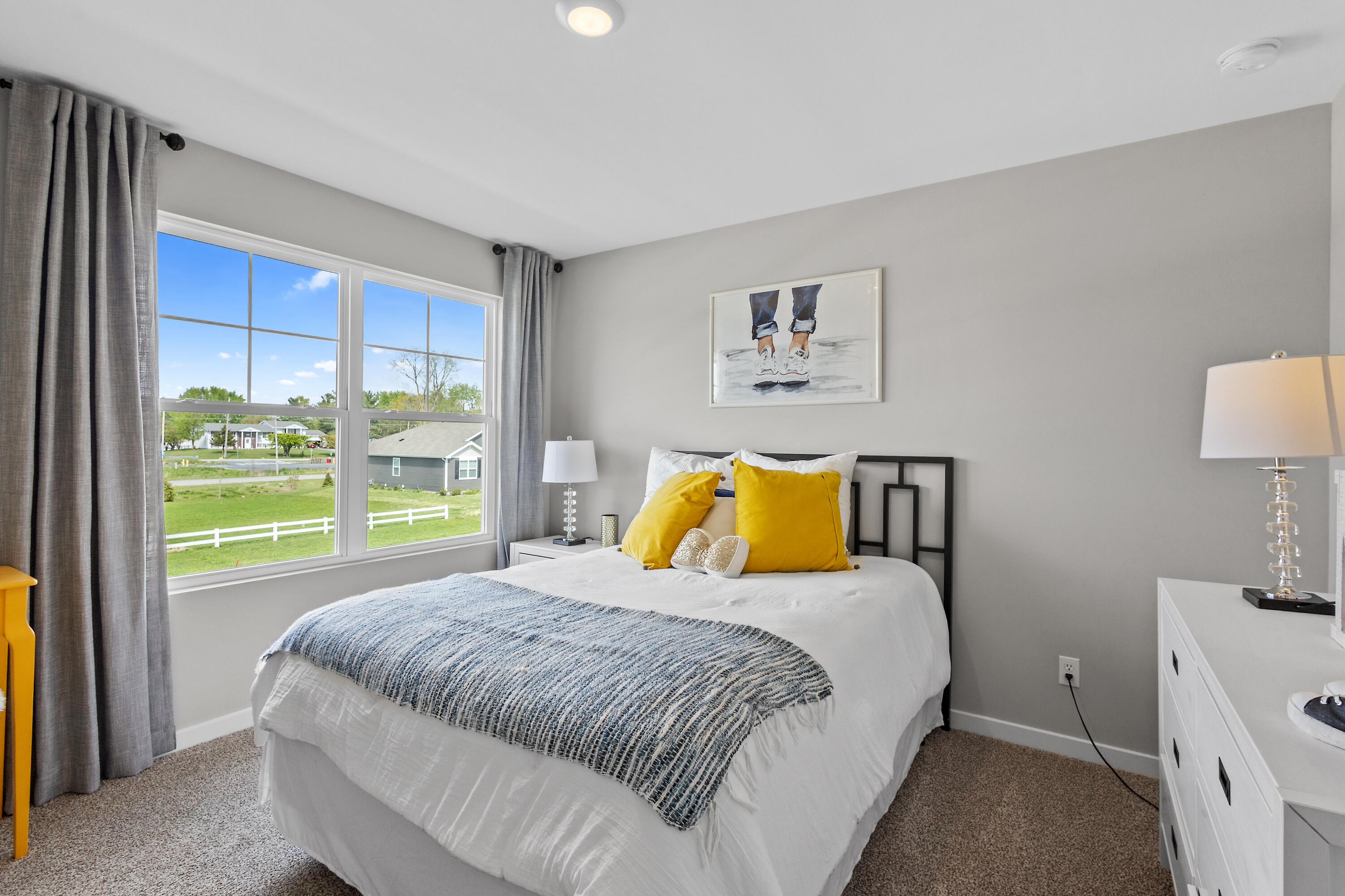 423 Fry Street Hebron, IN 46341 - Photo 27 of 32 a bed sitting in a bedroom next to a window