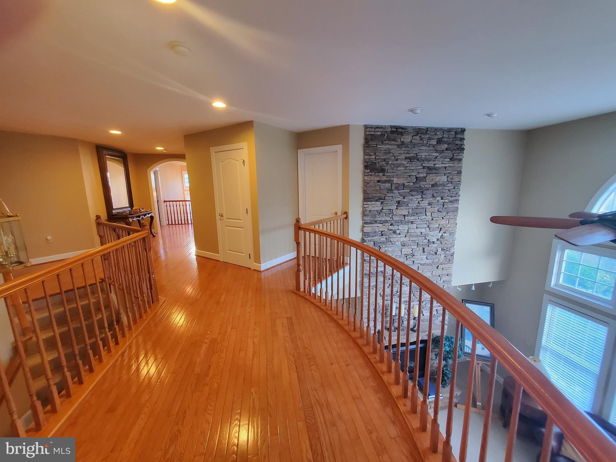 14418 Ashleigh Greene Road Boyds, MD 20841 - Photo 12 of 31 a view of a hallway with wooden floor
