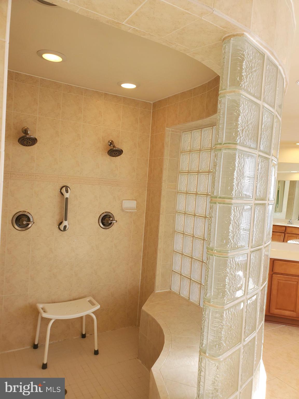 14418 Ashleigh Greene Road Boyds, MD 20841 - Photo 16 of 31 a bathroom with a toilet and shower