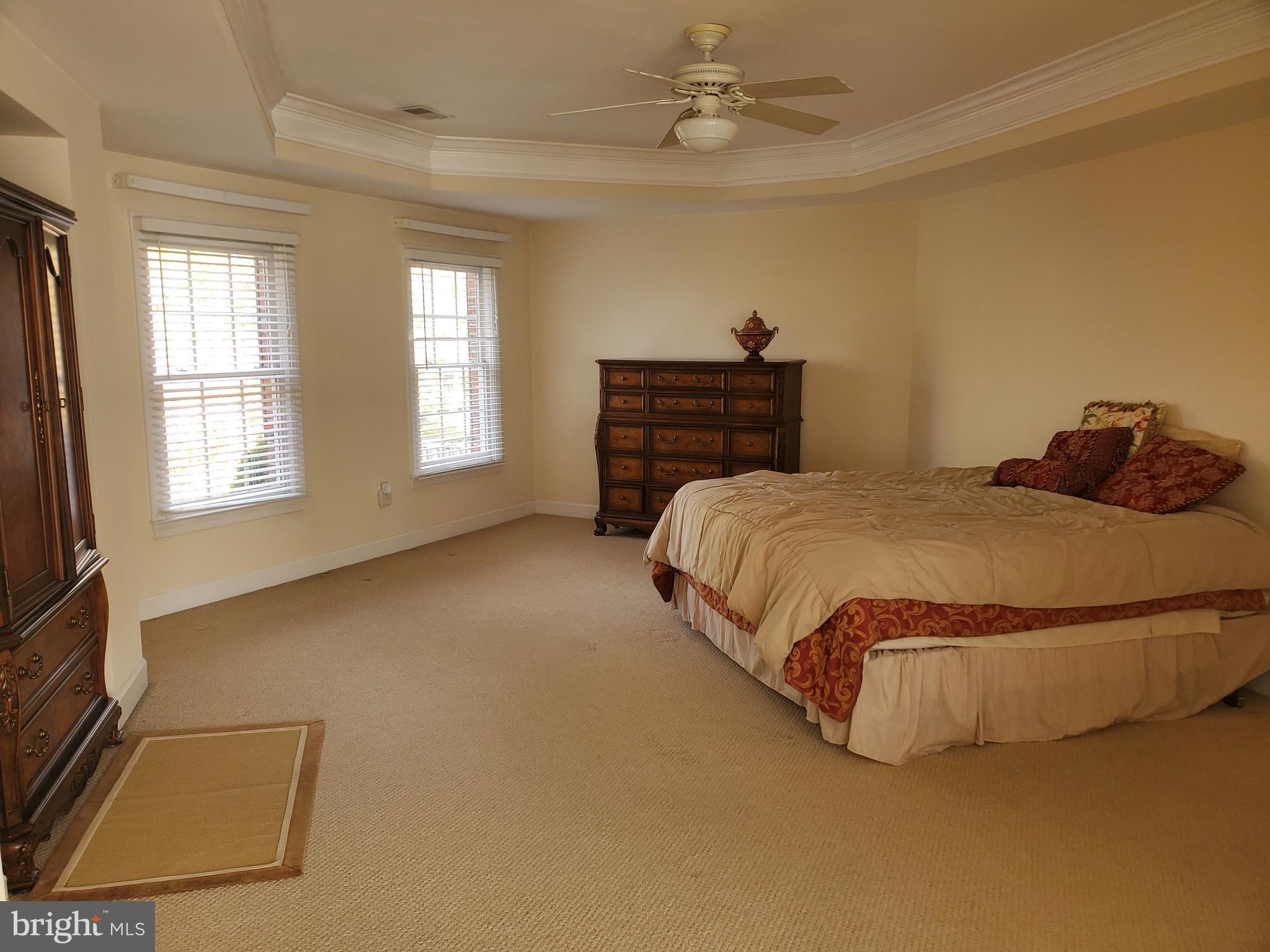 14418 Ashleigh Greene Road Boyds, MD 20841 - Photo 17 of 31 a bedroom with a bed and window
