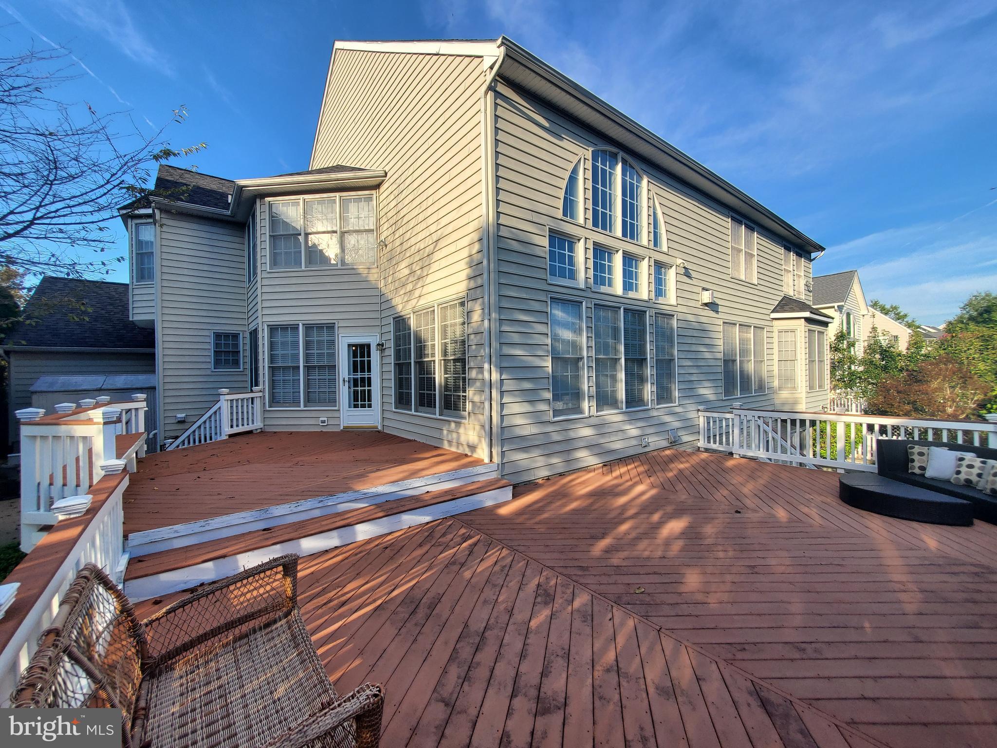 14418 Ashleigh Greene Road Boyds, MD 20841 - Photo 23 of 31 a backyard of a house with barbeque oven table and chairs