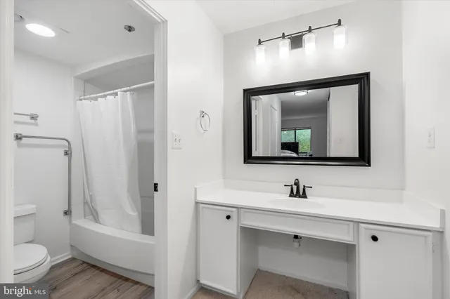 a bed room with furniture and a window