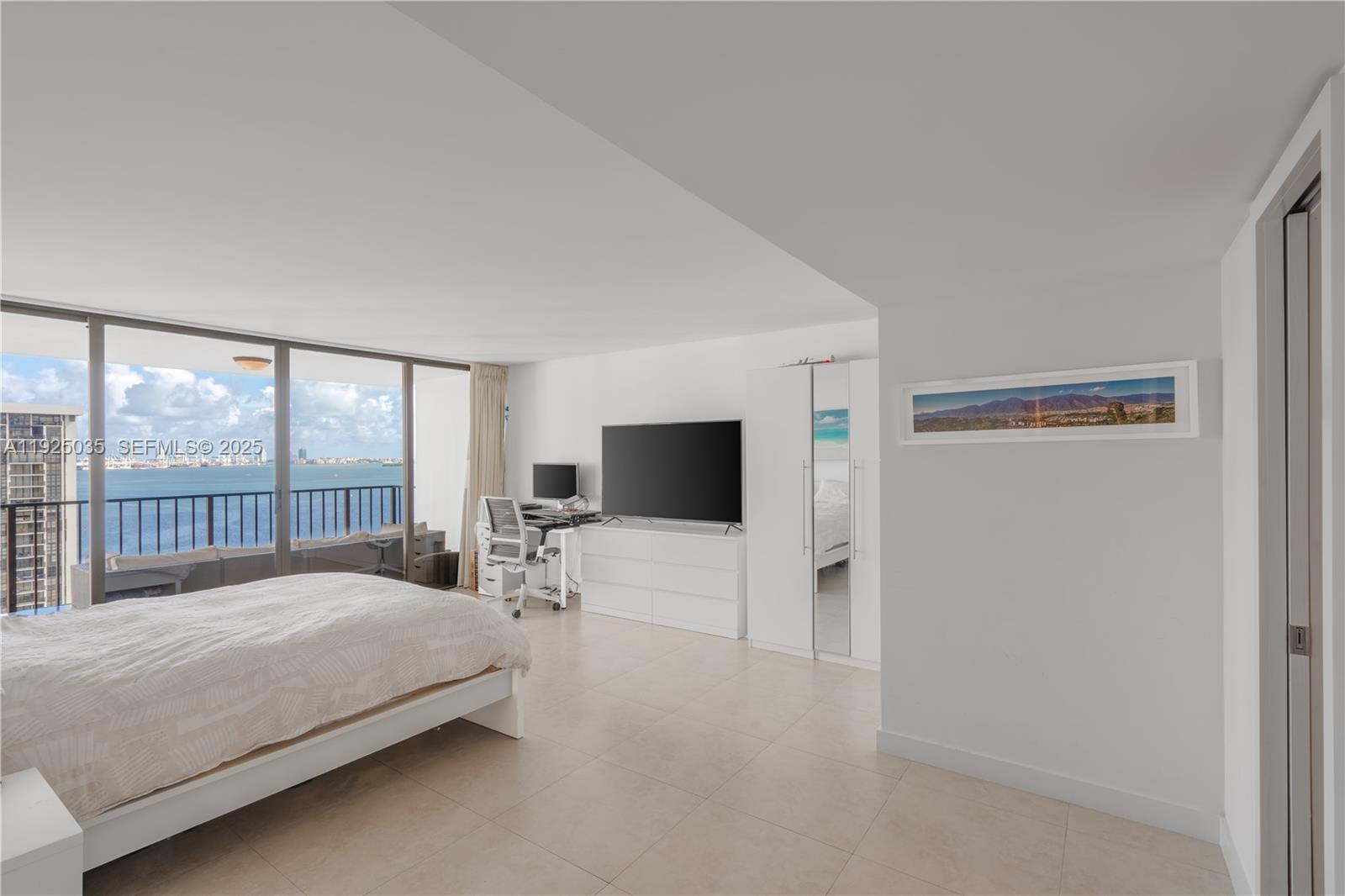 1925 Brickell Avenue, Unit D2006 Miami, FL 33129 - Photo 15 of 46 a large bedroom with a bed and large window