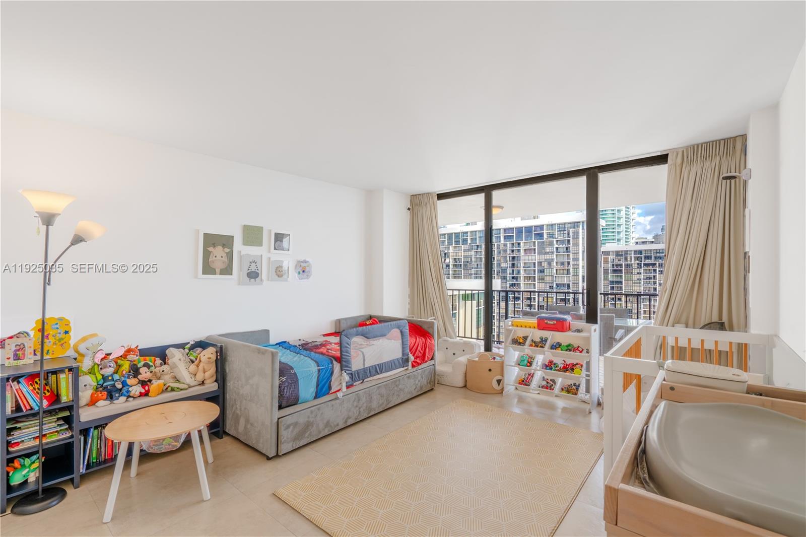 1925 Brickell Avenue, Unit D2006 Miami, FL 33129 - Photo 22 of 46 a living room with furniture and a large window