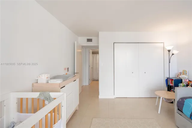 a bathroom with a bathtub sink mirror and toilet