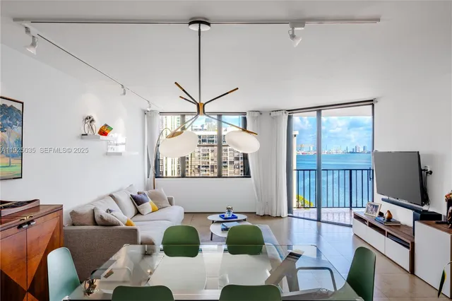 a living room with furniture and flat screen tv