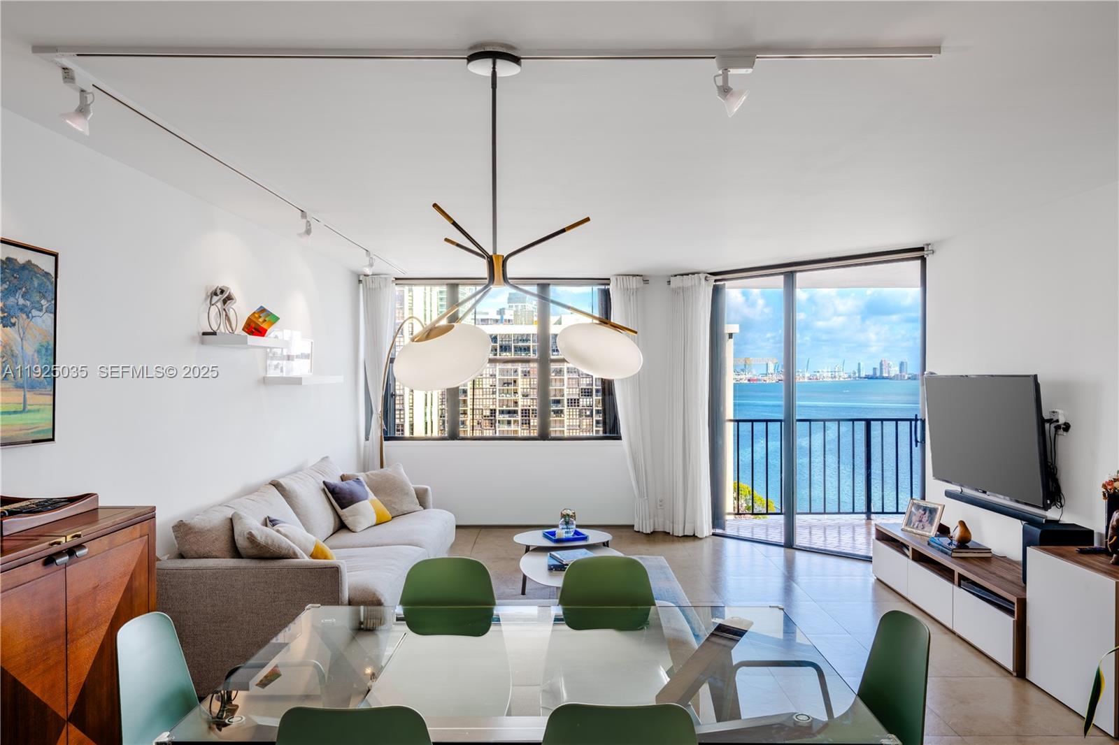 1925 Brickell Avenue, Unit D2006 Miami, FL 33129 - Photo 3 of 46 a living room with furniture and flat screen tv