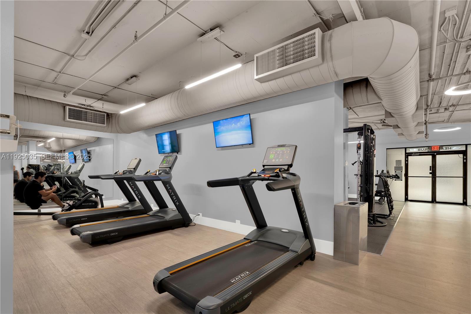 1925 Brickell Avenue, Unit D2006 Miami, FL 33129 - Photo 32 of 46 a view of a room with gym equipment