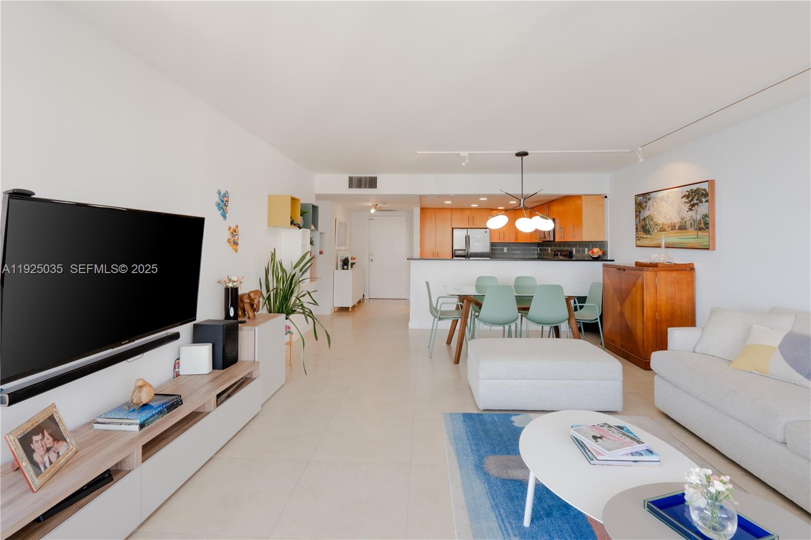 1925 Brickell Avenue, Unit D2006 Miami, FL 33129 - Photo 9 of 46 a living room with furniture and a flat screen tv