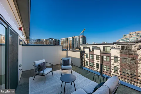 a view of a balcony with chairs