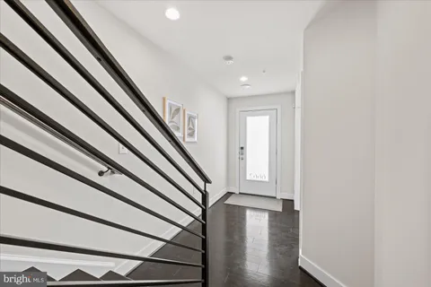 a view of entryway with wooden floor