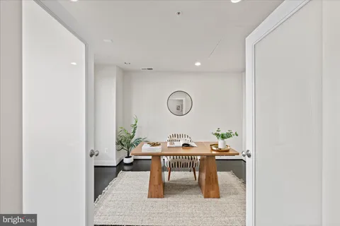 hallway with table and a couch