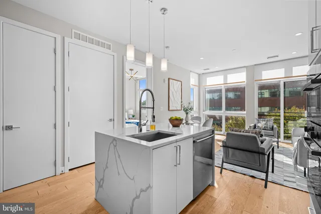 a kitchen that has a sink and a large window