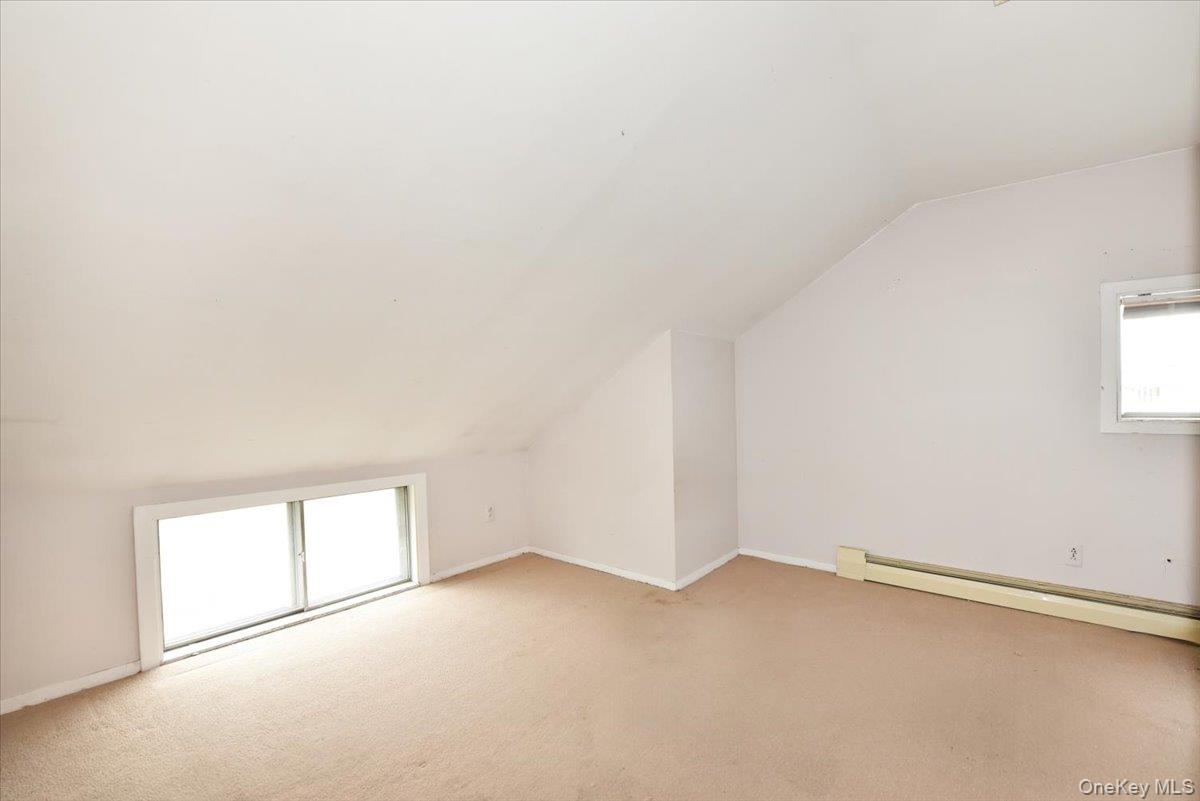 307 Blacksmith Road Levittown, NY 11756 - Photo 20 of 27 an empty room with a empty space and window